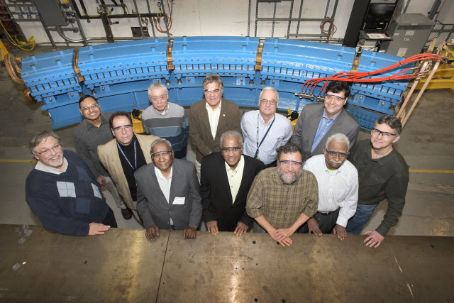 Members of the collaborative team that is designing and testing a magnet assembly for a prototype particle-beam cancer therapy accelerator