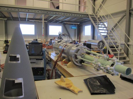 The forward section of the experimental rocket, right, showing several of the scientific instruments that will measure the dusty plasma