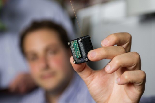 Man holding micro gas chromatograph