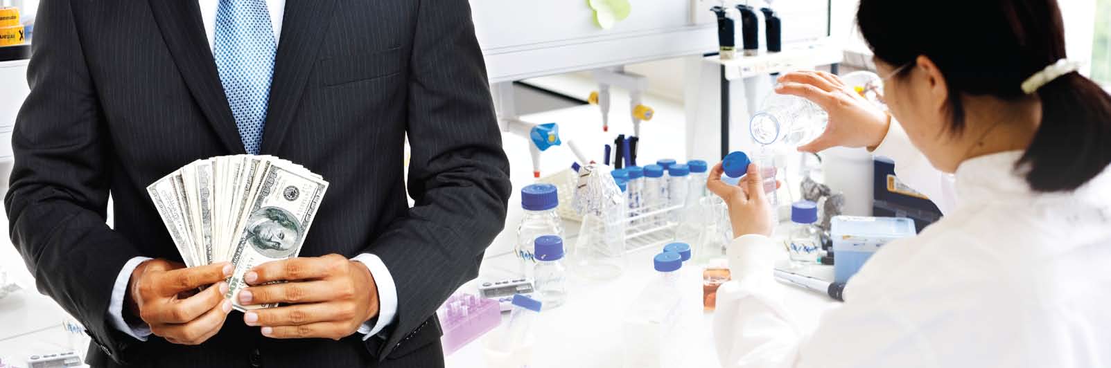 Tuxedo'd body holding a fan of paper money, next to a woman working at a lab bench