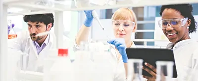 Scientists working together in lab