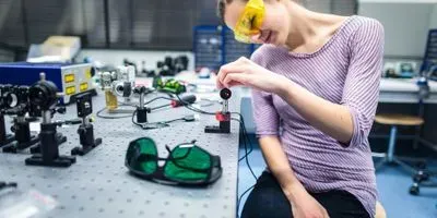researcher in quantum optics lab