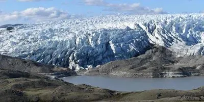 A newly forming lake at the edge of the Greenland ice sheet
