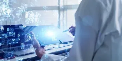 Blue overlay of hand holding a stylus