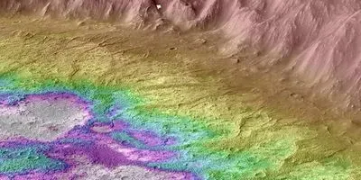 A topographic map of Mars shows the raised ridges (dark yellow) and low-lying areas where water ponded (white)