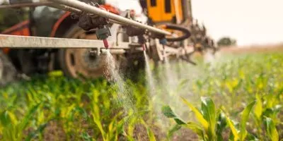 spraying pesticides on crops