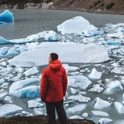 Man looking at ice bergs