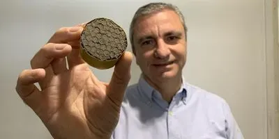 Professor Michele Meo with lightweight aerogel suspended in a honeycomb structure