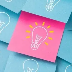 Sticky notes with light bulbs drawn on them