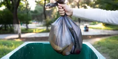 Person throwing out trash