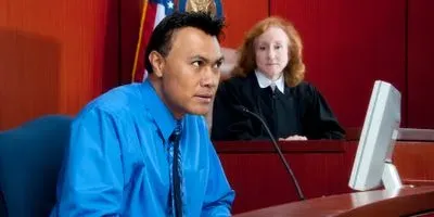 Image of a man giving testamony in court