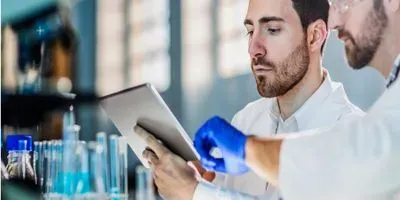 Scientist looking at in iPad