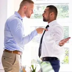 Two men having a fight at work