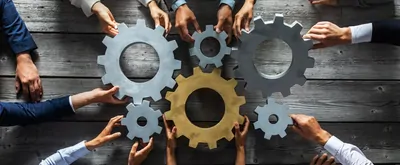 moving gears representing teamwork concept