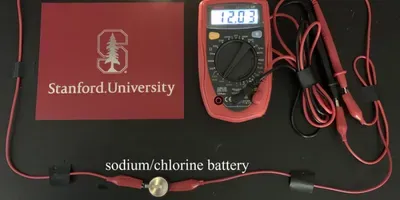 An LED light powered by a prototype rechargeable battery using the sodium-chlorine chemistry developed recently by researchers at Stanford University.