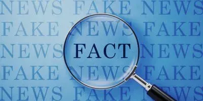 A magnifying lens over the word fact