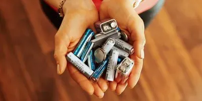 Person holding batteries