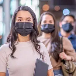University students ina line with masks on