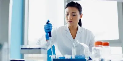 Researcher pippetting