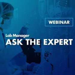 Two people wearing goggles, masks, and protective gloves, assessing samples.