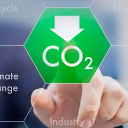 A man pushing a button indicating lower CO2 