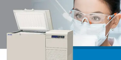 The face of a female scientist looking at a cryogenically frozen sample in the lab
