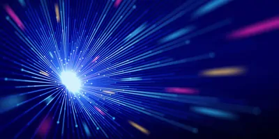 Abstract image of light and particles shining towards the camera