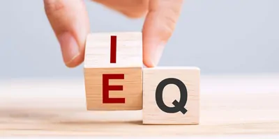 Wooden blocks with the letters EQ on them 