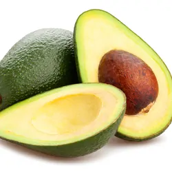 Avacados cut in half on a white backdrop