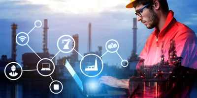 Engineer processing data with an oil rig in the background