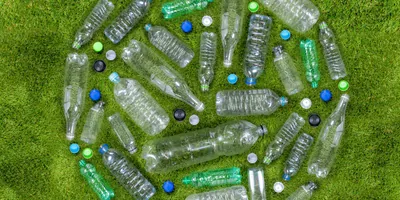 Plastic bottles arranged in a circle on a lawn
