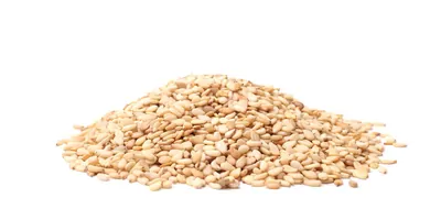 A pile of sesame seeds on a white background
