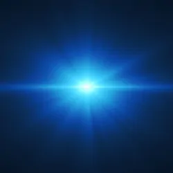 Blue light on black background shinning at camera