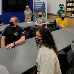 Students, faculty, and law enforcement partners commemorate the innovative collaboration between George Mason University and FARO.