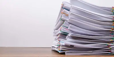 Stack of paper on a desk