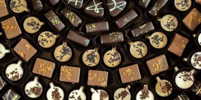 Chocolate candies lid out in an arcing pattern