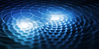 A blue sheet with two points causing wave vibrations that are interfering with each other