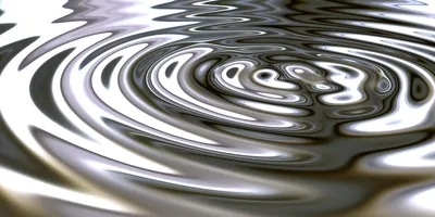 A metalic colored liquid, rippling