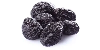 Prunes on a white background