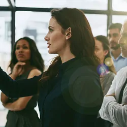 Female leader showing process to staff