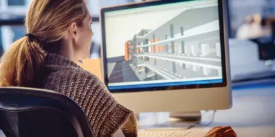 Female architect working on a computer in the office.