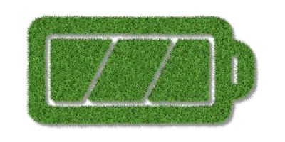 Grass grown in the shape of a battery charged symbol, on a white background