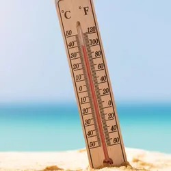 A thermometer on a beach