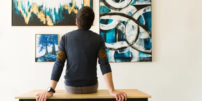 Man looking at art in a gallery