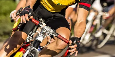 A man riding a bike in a bike race for which he will need to take tramadol for his acute pain