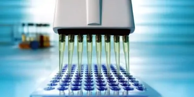 Micropipetter filling a sample tray