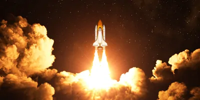 A space shuttle taking off at night