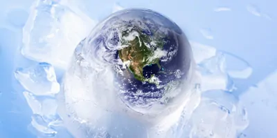 Globe incased in slowly melting ice