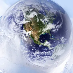 Globe incased in slowly melting ice