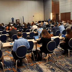 A room full of more than 100 attendees gathers for the first day of the 2022 Lab Manager Leadership Summit